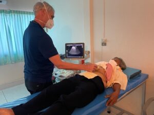 Physician provides abdominal ultrasound for patient
